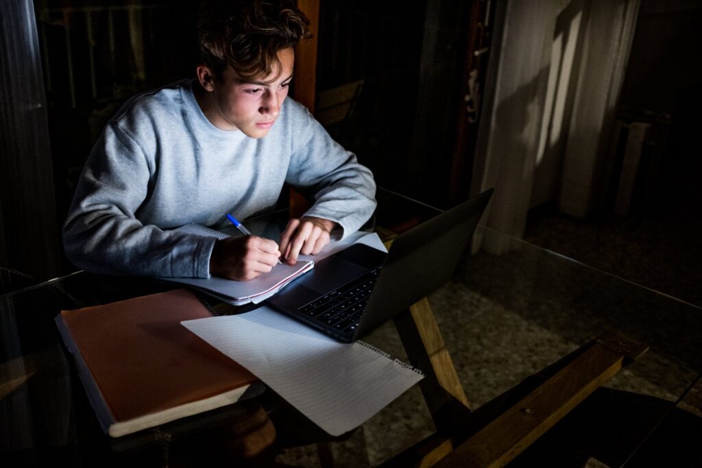 Student takes college classes at night.